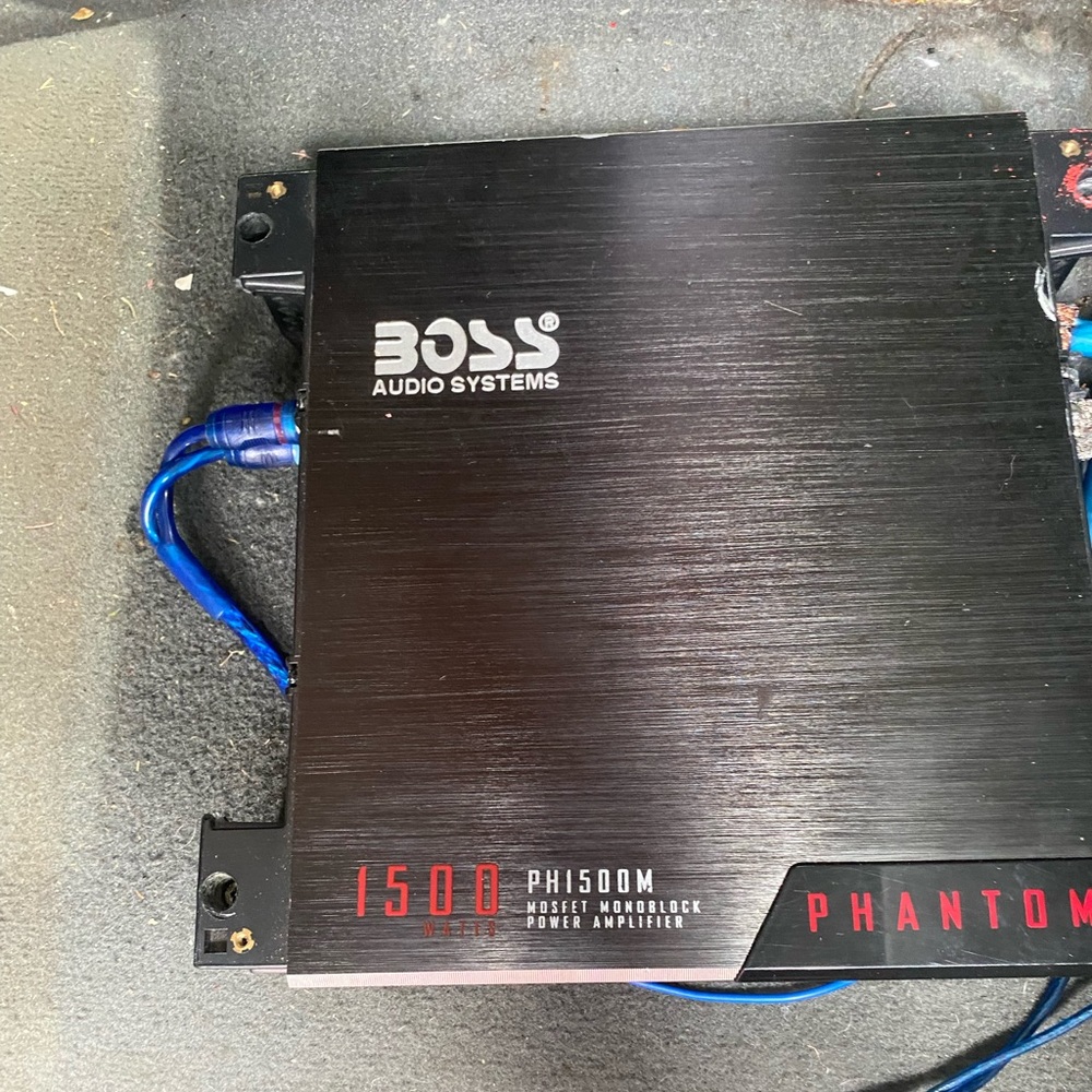 Boss amp 1500 watt and a 12in MTX subwoofer with Custom Box